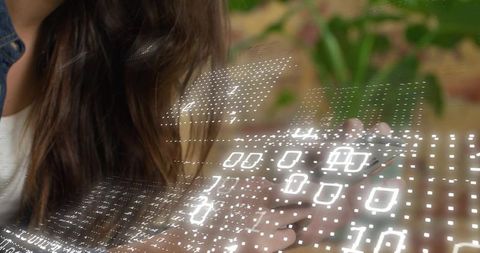 Woman Holding Smartphone Viewing Holographic Binary Data Overlay in Modern Workspace with Plant
