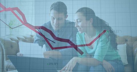 Caucasian couple analyzing financial data on laptop