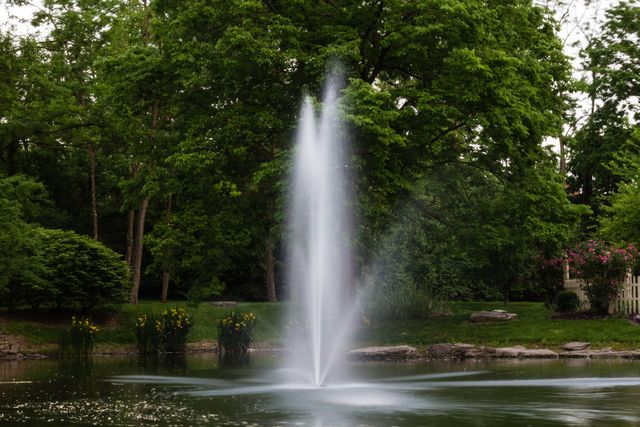 Elegant Water Fountain in Serene Green Park - Download Free Stock Photos Pikwizard.com