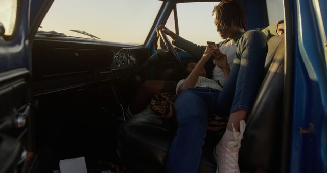 Young Couple Sitting Relaxed in Vintage Car at Sunset - Download Free Stock Images Pikwizard.com