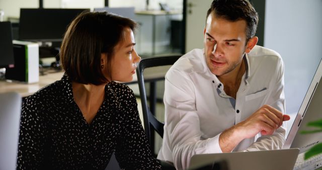 Female and Male Colleagues Discussing Project in Office - Download Free Stock Images Pikwizard.com