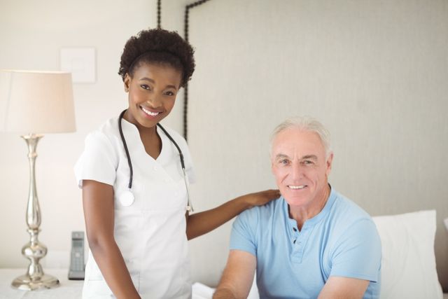 Nurse providing care and support to a senior man in a home setting. Ideal for use in healthcare, elderly care, and home care service promotions. Can be used in brochures, websites, and advertisements related to medical and caregiving services.