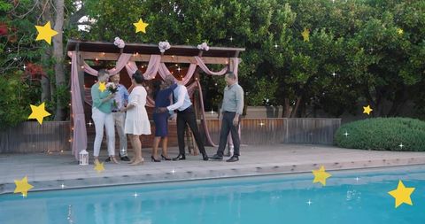 Backyard micro wedding by pool with draped pergola, guests greeting and bouquet