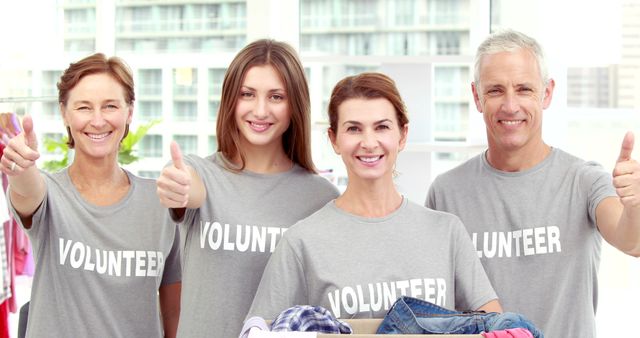 Diverse group of volunteers giving thumbs up - Download Free Stock Images Pikwizard.com