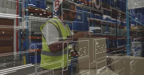 Warehouse worker scanning boxes with digital interface overlay