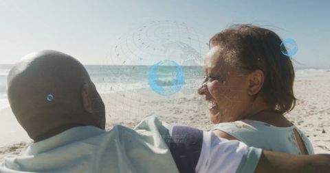 Senior Couple Laughing at Beach with Digital Data Overlay