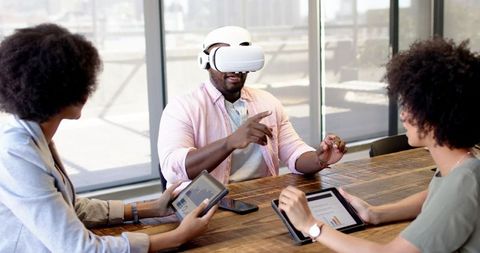 Coworkers Engaged in Virtual Reality Technology Meeting