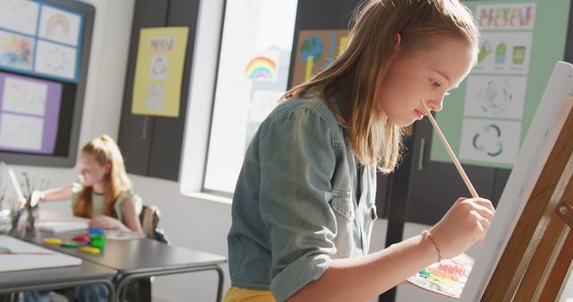 Girls Participating in Art Class, Painting on Canvas and Desk - Download Free Stock Images Pikwizard.com