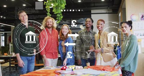 Creative team collaborating around fabric samples with fintech graphics and currency icons