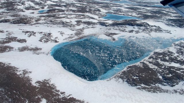 Frozen meltwater lake along the northeast Greenland coast, as seen from NASA's P-3B aircraft on May 7, 2012.   Credit: NASA/Jim Yungel  ===========  IceBridge, a six-year NASA mission, is the largest airborne survey of Earth's polar ice ever flown. It will yield an unprecedented three-dimensional view of Arctic and Antarctic ice sheets, ice shelves and sea ice. These flights will provide a yearly, multi-instrument look at the behavior of the rapidly changing features of the Greenland and Antarctic ice.  Data collected during IceBridge will help scientists bridge the gap in polar observations between NASA's Ice, Cloud and Land Elevation Satellite (ICESat) -- in orbit since 2003 -- and ICESat-2, planned for early 2016. ICESat stopped collecting science data in 2009, making IceBridge critical for ensuring a continuous series of observations.  IceBridge will use airborne instruments to map Arctic and Antarctic areas once a year. IceBridge flights are conducted in March-May over Greenland and in October-November over Antarctica. Other smaller airborne surveys around the world are also part of the IceBridge campaign.  To read more about IceBridge - Arctic 2012 go to: <a href="http://www.nasa.gov/mission_pages/icebridge/index.html" rel="nofollow">www.nasa.gov/mission_pages/icebridge/index.html</a>   <b><a href="http://www.nasa.gov/audience/formedia/features/MP_Photo_Guidelines.html" rel="nofollow">NASA image use policy.</a></b>  <b><a href="http://www.nasa.gov/centers/goddard/home/index.html" rel="nofollow">NASA Goddard Space Flight Center</a></b> enables NASA’s mission through four scientific endeavors: Earth Science, Heliophysics, Solar System Exploration, and Astrophysics. Goddard plays a leading role in NASA’s accomplishments by contributing compelling scientific knowledge to advance the Agency’s mission.  <b>Follow us on <a href="http://twitter.com/NASA_GoddardPix" rel="nofollow">Twitter</a></b>  <b>Like us on <a href="http://www.facebook.com/pages/Greenbelt-MD/NASA-Goddard/395013845897?ref=tsd" rel="nofollow">Facebook</a></b>  <b>Find us on <a href="http://instagrid.me/nasagoddard/?vm=grid" rel="nofollow">Instagram</a></b>
