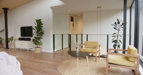 Minimalist Living Room with Mustard Armchairs and Natural Light