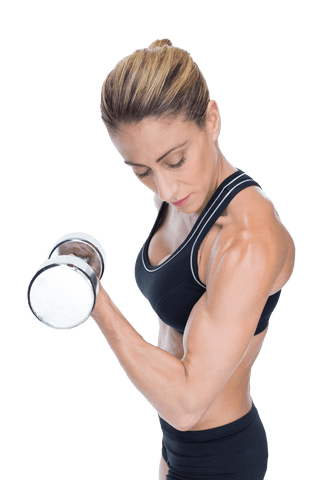Strong female bodybuilder holding dumbbell with focused look