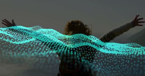 Peaceful Woman Embracing Nature with Technology Overlay