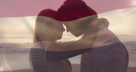 Romantic Couple Embracing on Beach at Sunset with Tricolor Light Overlay