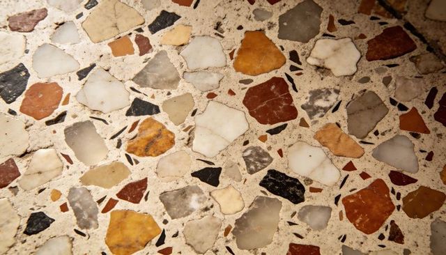 Terrazzo floor close-up showing multicolor marble and stone chips with polished texture