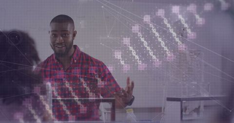 Teacher Demonstrating DNA and Data Concepts in Classroom