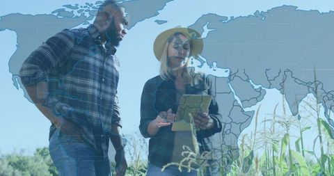 Diverse agritech team using tablet for geospatial crop analytics in cornfield