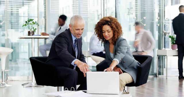 Senior and Young Business Professionals Discussing Project in Modern Office - Download Free Stock Images Pikwizard.com