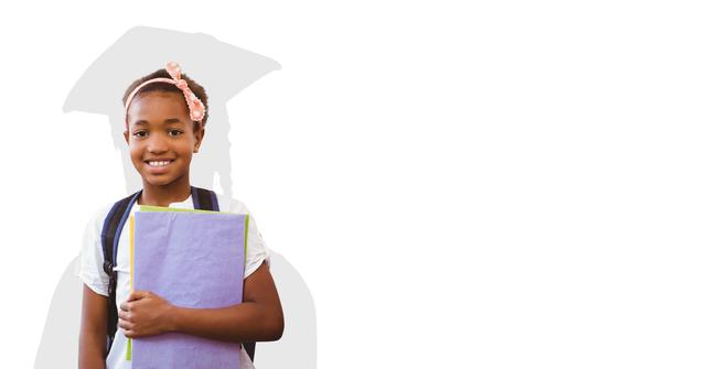 Digital composite of Digitally generated image of smiling girl holding book with shadow of graduate student in background