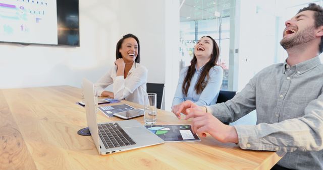 Diverse Colleagues Laughing During Business Presentation in Modern Office - Download Free Stock Images Pikwizard.com