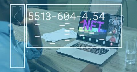 Professional Reviewing NFT on Laptop in Office Setting