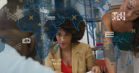 Diverse business team planning with digital world map overlay