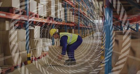 Warehouse worker practicing safe lifting techniques