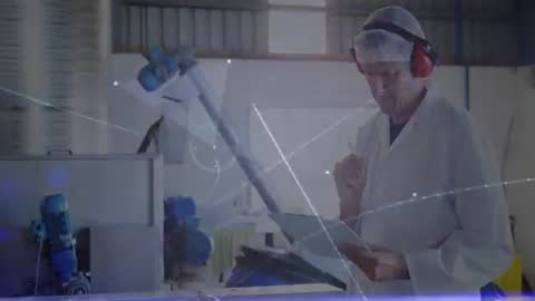 Technician Analyzing Data in Food Processing Plant