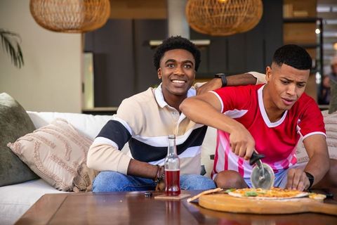 Casual Evening with Friends and Pizza in Modern Living Room