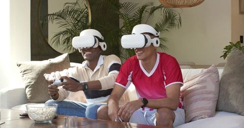 Diverse Friends Gaming with VR Headsets in Living Room