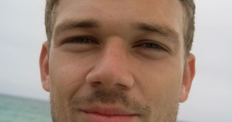 Close-up Portrait of Smiling Man at Beach - Download Free Stock Images Pikwizard.com