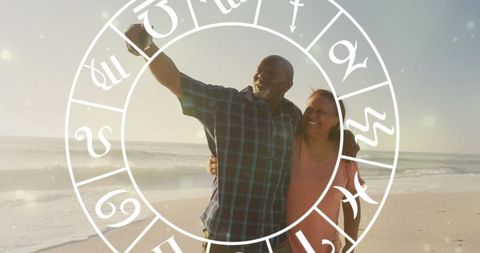 Senior Couple Enjoying Beach Walk with Astrological Overlay - Download Free Stock Images Pikwizard.com