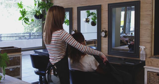 Hairdresser Preparing Client for Haircut in Modern Salon - Download Free Stock Images Pikwizard.com