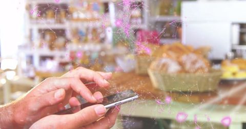 hands holding smartphone with digital network overlaid in cozy bakery - Download Free Stock Images Pikwizard.com