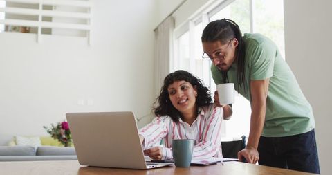 Couple Collaborating with Laptop for Paperwork Together - Download Free Stock Images Pikwizard.com