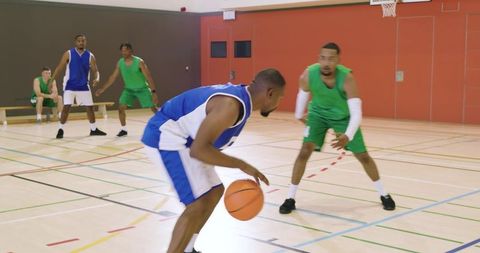Diverse basketball players dribbling and pivoting showcasing agility and sportsmanship