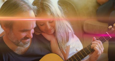 Father and Daughter Creating Music Together in Cozy Living Room