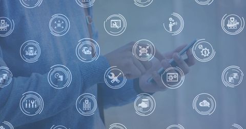 Hands using smartphone with digital technology icons overlay