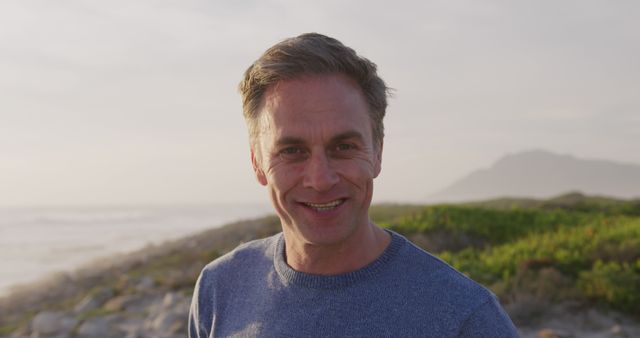 Smiling Man Enjoying Coastal Landscape - Download Free Stock Images Pikwizard.com