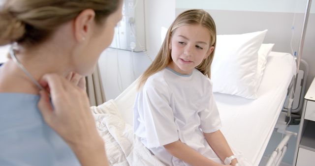 Doctor and Young Patient Communicating in Hospital Room - Download Free Stock Images Pikwizard.com