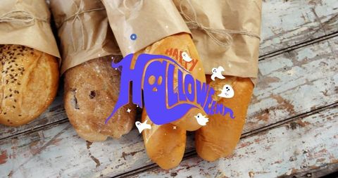 Artisan Loaves with Halloween Ghost Graphic on Rustic Table