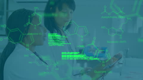 Diverse Female Scientists Analyzing Data in Medical Laboratory