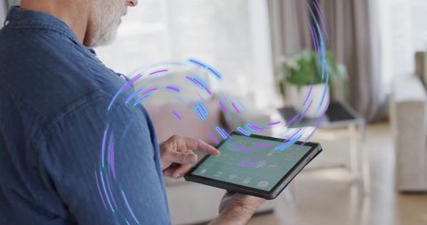 Caucasian Man Using Tablet with Smart Home Interface - Download Free Stock Images Pikwizard.com