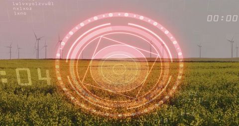 Projecting futuristic hud over canola field with wind turbines on horizon