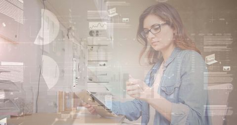 Businesswoman Analyzing Data on Tablet