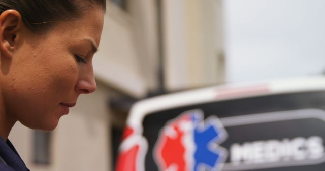 Female Paramedic Focused on Her Work Outside Ambulance - Download Free Stock Images Pikwizard.com