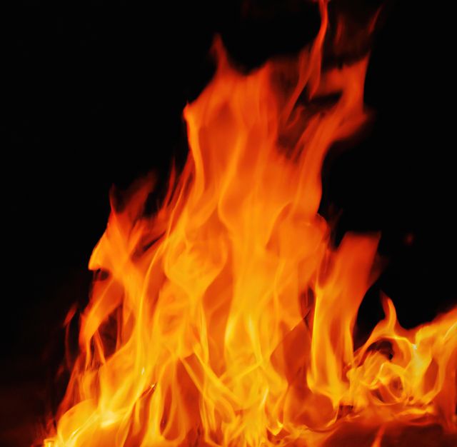 Close Up of Vibrant Orange Flames in Darkness - Download Free Stock Images Pikwizard.com