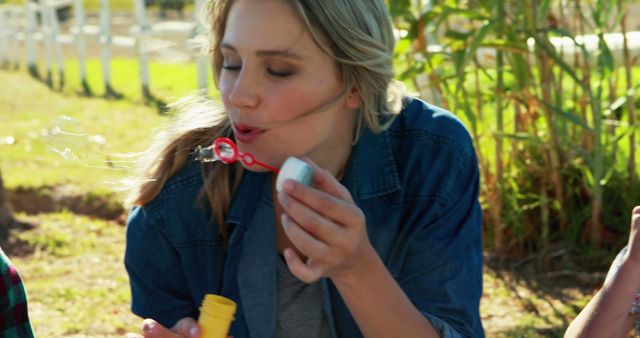 Woman Blowing Bubbles in Park - Download Free Stock Images Pikwizard.com