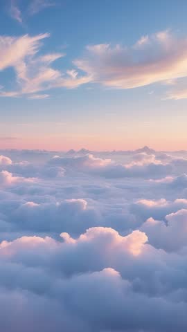 Vertical drone footage maintaining flight above dense pastel cloud layer at dawn