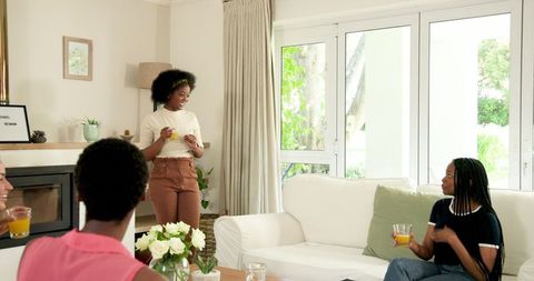 Friends Conversing in Cozy Living Room Setting